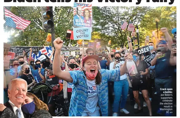  ?? AFP ?? Crack open a bottle: Joe Biden’s supporters celebrate the election result in Washington DC