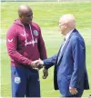  ?? PHOTO: TRACEY ROXBURGH ?? West Indies cricket team manager Rawl Lewis meets Queenstown Lakes mayor Jim Boult at the Queenstown Events Centre's Sir John Davies Oval on Monday.