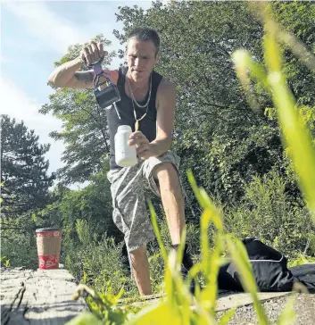  ?? JULIE JOCSAK/STANDARD STAFF ?? Fred Bowering picks up used needles regularly from Centennial Gardens in St. Catharines. There is an online petition on change.org calling on the City of St. Catharines to get behind creation of a safe injection site, as it claims large numbers of used...