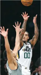  ??  ?? Utah Jazz guard Jordan Clarkson releases a 3-point shot over Brooklyn Nets guard Timothe Luwawu-Cabarrot yesterday in New York. (AP)