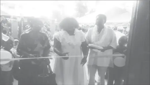  ??  ?? Minister Simona Broomes (at centre) cuts the ribbon to open the Buxton/Friendship Museum, Archives and Culture Centre yesterday.