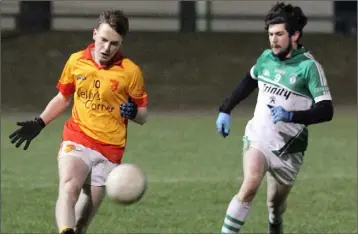  ??  ?? Conall Clancy of Sarsfields delivers the ball in the Roinn 1 U21 final as Connal Flood looks on.