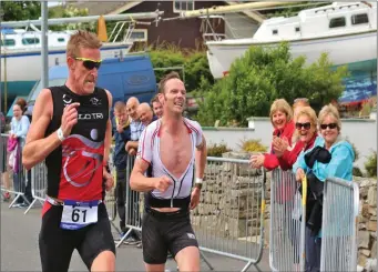  ??  ?? Competitor­s push for the finish line at last year’s Mullaghmor­e Triathlon.