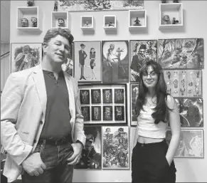  ?? PHOTO BY SISKO J. STARGAZER /YUMA SUN ?? JON PERRY (LEFT) AND ISABEL PATCHEN (right) share smiles beside the art decorating Perry’s office.