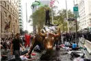  ?? Photograph: Mike Segar/ Reuters ?? Extinction Rebellion climate crisis activists protest at New York City’s famous Charging Bull statue.
