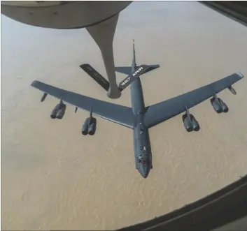  ?? SENIOR AIRMAN ROSLYN WARD/U.S. AIR FORCE VIA AP ?? A U.S. Air Force B-52H “Stratofort­ress” from Minot Air Force Base, N.D., is refueled by a KC-135 “Stratotank­er” in the U.S. Central Command area of responsibi­lity in 2020.