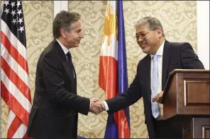  ?? (AP/Eloisa Lopez) ?? U.S. Secretary of State Antony Blinken (left) shakes hands with Philippine Foreign Affairs secretary Enrique Manalo during a joint news conference in Manila, Philippine­s, on Tuesday.