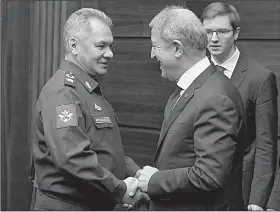  ?? AP/Russian Defense Ministry Press Service/VADIM SAVITSKY ?? Russia’s Defense Minister Sergei Shoigu Saturday in Moscow. (left) and Turkey’s Defense Minister Hulusi Akar meet