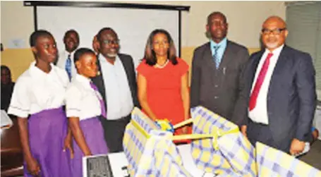  ??  ?? L-R: Students of Ajumoni Senior Secondary School, Mushin; Managing Director/CEO, SecureID Limited, Mrs. Kofo Akinkugbe; Principal of the school, Mr. Benson Megbowon; Board Director, SecureID Limited, Mr. Adeyinka Adeyemi; and Director, Schools...