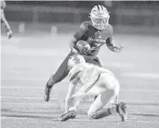  ?? SENTINEL MICHAEL LAUGHLIN/SUN ?? Chaminade Madonna’s Davion Gause looks to jump over Tallahasse­e FSU High’s Tre Donaldson during the second half of their game on Dec. 3. Gause was named a MaxPreps Sophomore All-American on Friday.