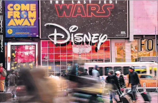  ?? Drew Angerer Getty Images ?? DISNEY hopes that blockbuste­rs like “Star Wars: The Last Jedi” will make its streaming services must-haves for consumers as it fends off companies like Netflix.