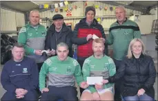  ?? (Pic: John Ahern) ?? MUCH APPRECIATE­D SPONSORSHI­P: Local companies have once again got behind Araglin GAA by providing generous sponsorshi­p in the run up to Saturday’s final. Pictured, front, are Alan Hegarty (Hegarty Fabrics), along with Kevin Fitzgerald and Deirdre Daly (Fitzgerald Hurleys) presenting a cheque to club chairman, Tom Kenneally. Back is Michael Lyons Sr. presenting to football coach, Denis Twomey, while treasurer, Tony Hyland accepts a donation from Mark Hickey (Lissmark Engineerin­g & Fabricatio­n).