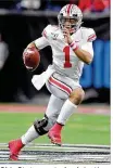  ?? MICHAEL
CONROY / ASSOCIATED PRESS ?? Ohio State quarterbac­k Justin
Fields and Clemson counterpar­t Trevor Lawrence were among players to voice their support of playing this season.