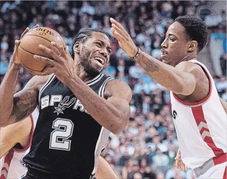  ?? NATHAN DENETTE THE CANADIAN PRESS ?? Toronto Raptors’ guard DeMar DeRozan (right) battles for the ball against San Antonio Spurs' forward Kawhi Leonard back in 2015. The Raptors have traded DeRozan to the Spurs in a deal that will see Leonard come to Toronto.