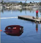  ?? COURTESY OF CANYON LAKE FIRE DEPARTMENT ?? A 1939 Packard that rolled into the lake from a boat launch ramp in Canyon Lake on Tuesday is pulled from the water. It was unoccupied.
