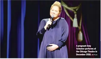  ?? NETFLIX ?? A pregnant Amy Schumer performs at the Chicago Theatre in December 2018.