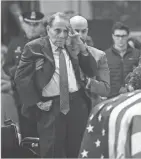  ?? JACK GRUBER/USA TODAY ?? Former Sen. Bob Dole stands and salutes the casket of President George H.W. Bush at the U.S. Capitol Rotunda on Dec. 4, 2018.