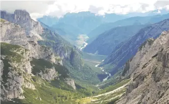  ?? ?? A short walk from the Rifugio Auronzo bus stop is this view of a valley-and the views from the bus rides are impressive as well.