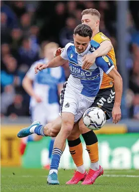  ?? ?? Aaron Collins comes under pressure from Newport’s James Clarke