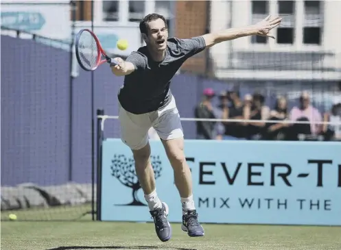  ??  ?? 0 Andy Murray stretches well to make a forehand return during a practice session at Queen’s Club yesterday.