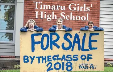  ?? JOHN BISSET/STUFF ?? Timaru Girls’ High School leavers Lily Bolland, left, Meg Stickings and Amelia O’Connor were some of the students behind a prank that listed the school for sale on Trade Me.