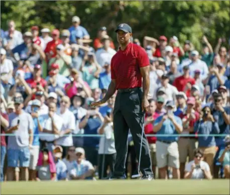  ?? THE ASSOCIATED PRESS ?? Tiger Woods reacts to a missed putt on the sixth hole during the final round of the Valspar Championsh­ip on Sunday.