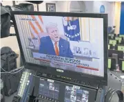  ?? BLOOMBERG ?? US President Donald Trump speaks during a recorded video on a television screen in the press briefing room at the White House in Washington, DC, on Wednesday.