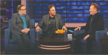  ?? TEAM COCO ?? Conan O'brien, right, celebrates the end of his late-night show with sidekick Andy Richter, left, and comedian Kevin Nealon, a series regular who credits O'brien with evolving from a high-spirited comedy writer on Saturday Night Live to the face of late-night television.