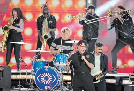  ?? NATHAN DENETTE THE CANADIAN PRESS FILE PHOTO ?? The Arkells perform during the 2022 Juno Awards in Toronto. The alt-rock ensemble have won Group of The Year for three consecutiv­e years.