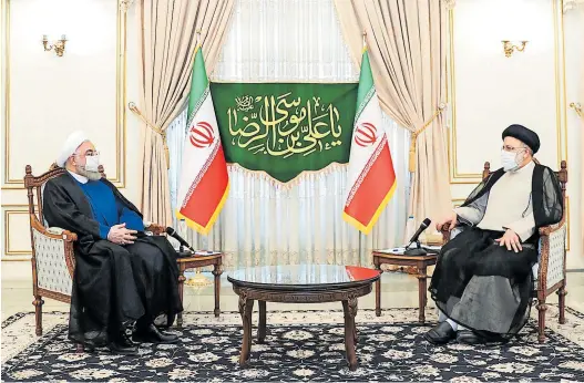  ?? AFP ?? Auf Hassan
Rohani (l.) folgt mit Ebrahim Raisi (r.) ein knallharte­r Konservati­ver an Irans ziviler Staatsspit­ze. Damit wird die Machtübern­ahme der Hardliner im Land komplett.