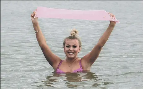  ??  ?? SASH SUCCESS Cerys' dip in the ocean for Kakembo Street Children's charity and Cancer Research UK