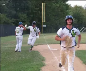  ?? MIKE CABREY — MEDIANEWS GROUP ?? Skippack manager Jeff Murtha (11) congratula­tes Jason Kelmer (24) after Kelmer rounds third following his three-run home run in the fifth inning against Collegevil­le in Game 3of their Perky League semifinal series Wednesday at Palmer Park. Chad Evans (right) heads home to score.