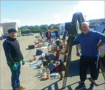  ??  ?? John Gibbons from Ballyduff who was hoping to buy a ladder from trader John Sweeney at the Market in Tralee on Sunday when business resumed after the lockdown. Photo Moss Joe Browne.