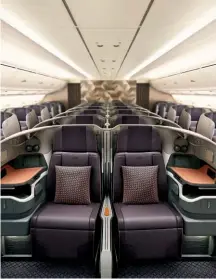  ??  ?? Clockwise from top left: A380 business class; the centre seats’ divider can be lowered to join beds; the seat features generous workspace