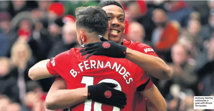  ??  ?? Anthony Martial celebrates a goal with Bruno Fernandes