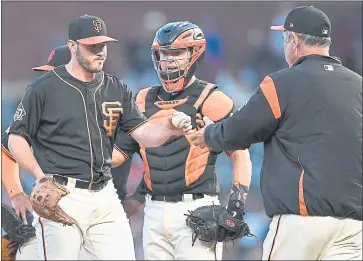  ?? THEARON W. HENDERSON — GETTY IMAGES ?? Manager Bruce Bochy of the Giants takes the ball from pitcher Ty Blach with catcher Nick Hundley looking on as Bochy takes Blach out of the game against the Milwaukee Brewers in the top of the eighth inning at AT&T Park on Saturday.