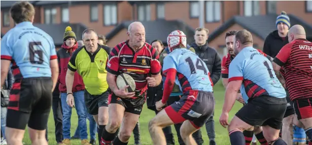  ?? Michael Tyrells ?? Clive Winstanley leads his Widnes Vets side from the front in their clash with the Widnes Junior Colts last weekend.