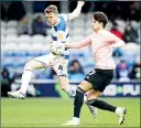  ?? ?? CLASH: QPR’s Rob Dickie, left, and Cardiff’s Rubin Colwill battle it out