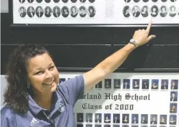  ?? STAFF PHOTO BY MARK KENNEDY ?? Karen Hughes, Ridgeland High School’s new principal, points out her photo in the school’s very first graduating class.