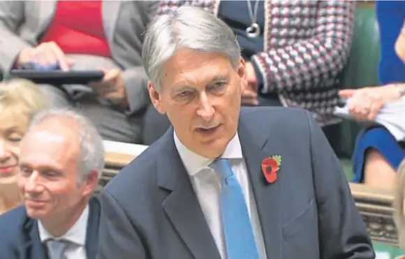  ?? Picture: PA. ?? Chancellor Philip Hammond delivers his Budget from the despatch box yesterday, claiming the end of austerity.