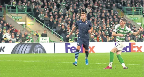  ?? Pictures: Getty/SNS. ?? Ryan Christie, in the middle of a two-match domestic ban, beats Lazio keeper Thomas Strakosha for Celtic’s equaliser.