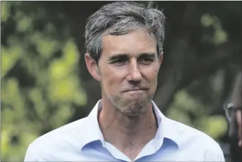  ?? AP PHOTO/LM OTERO ?? Democrat Beto O’Rourke listens to a volunteer before a Texas Organizing Project neighborho­od walk in West Dallas on June 9. O’Rourke is running for governor of Texas.