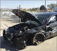  ?? PHOTO COURTESY OF PORTERVILL­E POLICE DEPARTMENT ?? A 2017 Dodge Charger police unit was badly damaged Monday after a collision with a drunk driver.