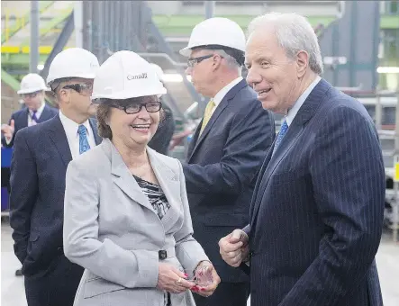  ?? ANDREW VAUGHAN/ THE CANADIAN PRESS FILES ?? Public Services and Procuremen­t Minister Judy Foote, left, visits the Irving Shipbuildi­ng facility in Halifax last June. Foote says changes are underway to make the procuremen­t system more transparen­t, less complicate­d and technologi­cally up-to-date.