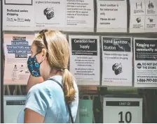  ?? PETER J. THOMPSON ?? A shopper visits Sobeys in Toronto on Thursday. A study found businesses that adopted technology were more resilient.