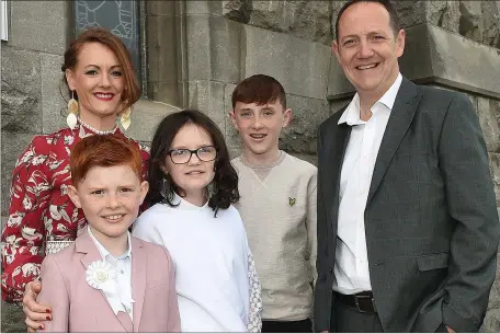  ??  ?? Ollie Carley from St. Mary’s school who received First Holy Communion in St. Mary’s churchpict­ured with his family .