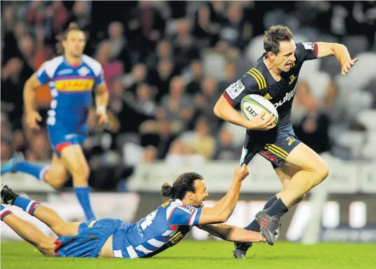  ?? Picture / Photosport ?? Ben Smith almost breaks clear during the Highlander­s’ win over the Stormers last night.