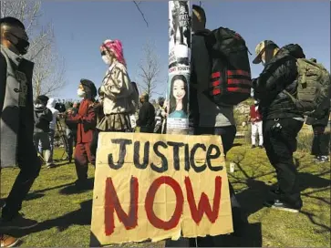  ?? Photograph­s by Genaro Molina Los Angeles Times ?? PEOPLE attend a rally condemning hate crimes against Asian Americans last month at Los Angeles State Historic Park. Ee Lee, whose photo is shown on a pole, was raped and killed in September in Milwaukee.