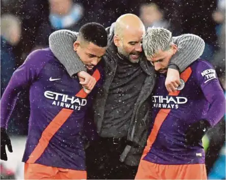  ??  ?? Manchester City manager Pep Guardiola (centre) celebrates with Sergio Aguero (right) and Gabriel Jesus after their win over Swansea in the FA Cup quarter-final. REUTERS PIC