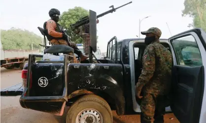  ?? Photograph: Afolabi Sotunde/Reuters ?? Members of Nigeria’s security forces in Zamfara last year.